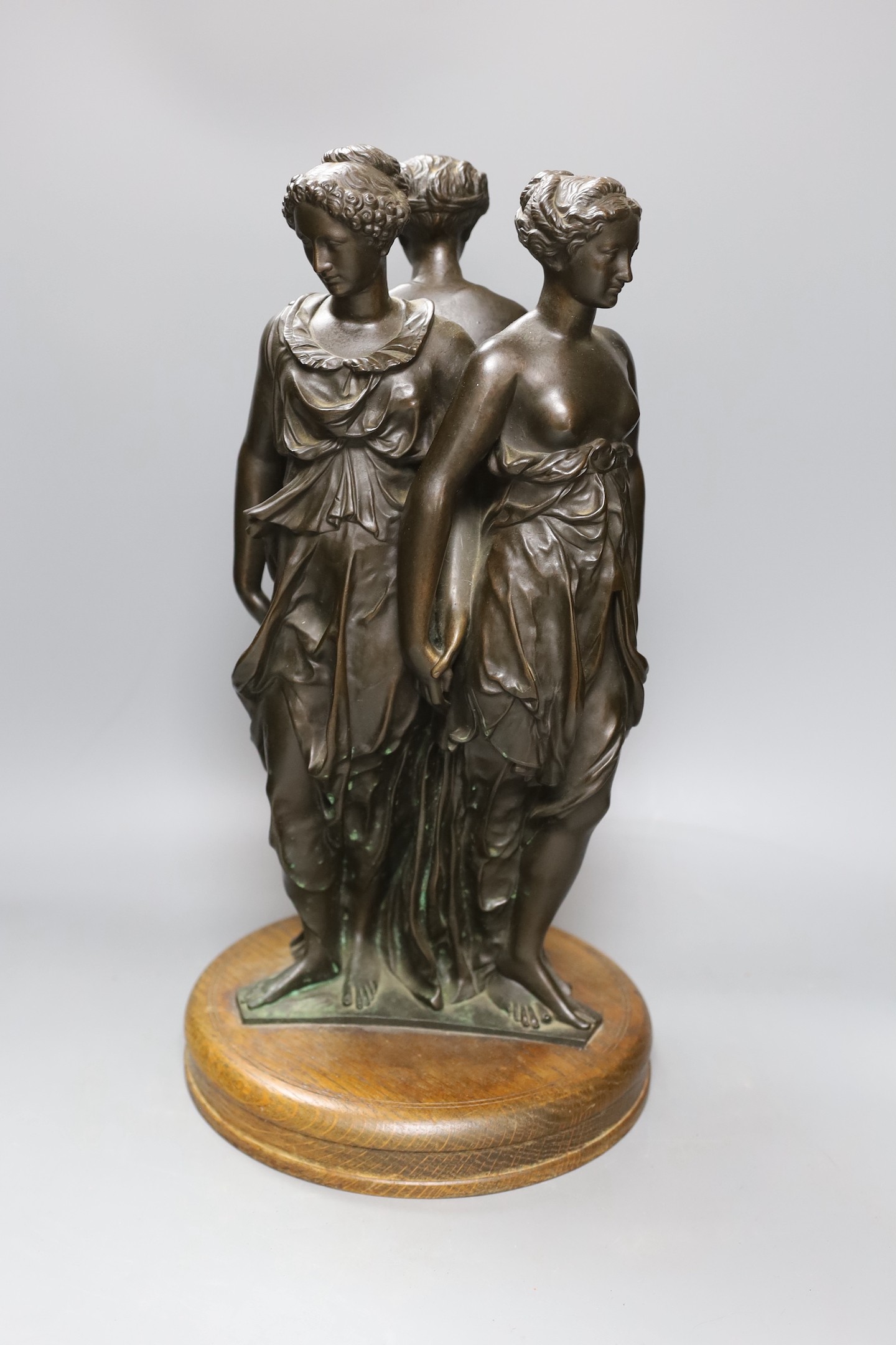 A Reduction de Sauvage bronze group 'The Three Graces', 44cms high including base.